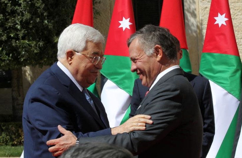 Jordan's King Abdullah meets Palestinian president Mahmoud Abbas at the Royal Palace in Amman, Jordan March 12, 2018.  (photo credit: REUTERS/MOHAMMAD ABU GHOSH/POOL)