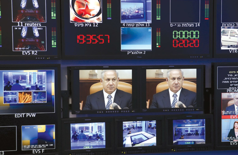 Media screens from Israeli media show Prime Minister Benjamin Netanyahu. (photo credit: REUTERS)
