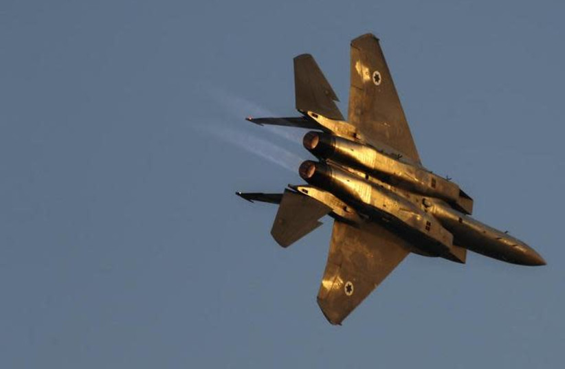 An Israeli air force F15 fighter jet flies during an exhibition as part of a pilot graduation ceremony at the Hatzerim air base, southern Israel June 25, 2009 (photo credit: AMIR COHEN/REUTERS)