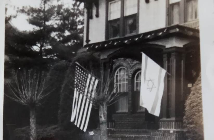 Thelma Jacobsn's childhood home, with Israeli and American flags flying out front (photo credit: Courtesy)