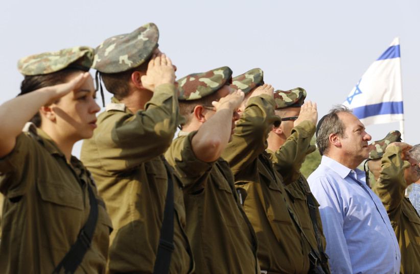 President and Founder of the International Fellowship of Christians and Jews, Rabbi Yechiel Eckstein, is seen with IDF soliders; the Fellowship is heavily invested in supporting its lone soldiers (credit: COURTESY IFCJ)