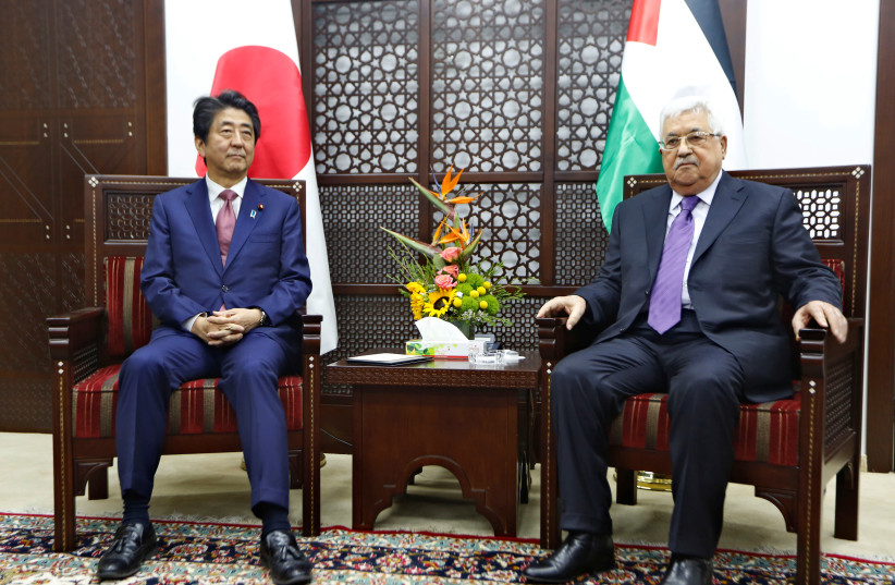 Palestinian President Mahmoud Abbas meets with Japan's Prime Minister Shinzo Abe in Ramallah (photo credit: REUTERS)