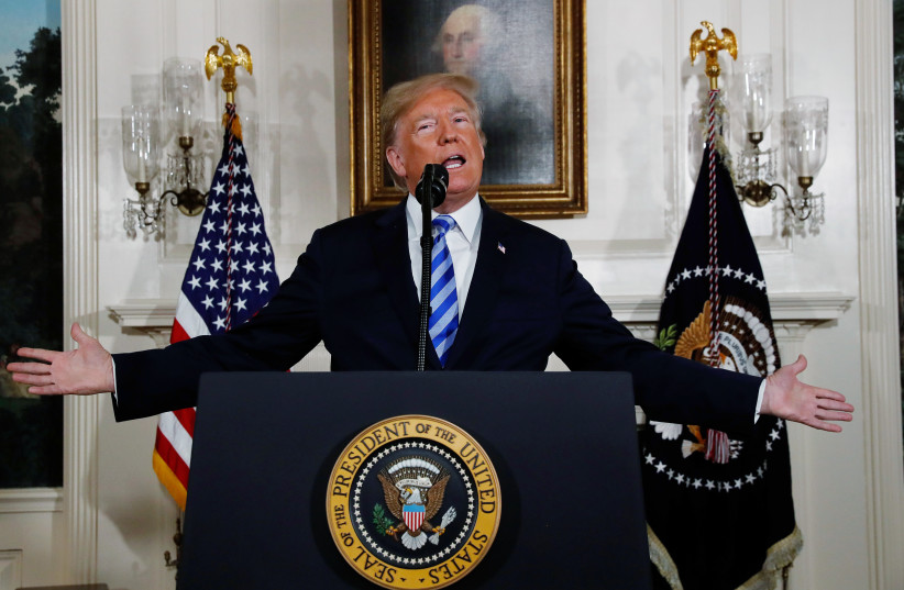 US President Donald Trump announces his intention to withdraw from the JCPOA Iran nuclear agreement during a statement in the Diplomatic Room at the White House in Washington, US, May 8, 2018 (photo credit: REUTERS/JONATHAN ERNST)