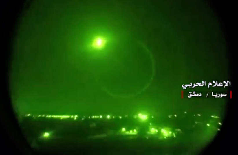 An image grab from a video released on May 10, 2018 by the "Central War Media" and broadcast on Syria's official TV purportedly shows Syrian air defense systems intercepting Israeli missiles over Syrian airspace (photo credit: AFP PHOTO / HO / CENTRAL WAR MEDIA)