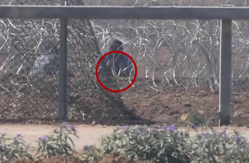 Palestinian protester attempting to damage security infrstructure at the Gaza border fence   (photo credit: IDF SPOKESMAN’S UNIT)
