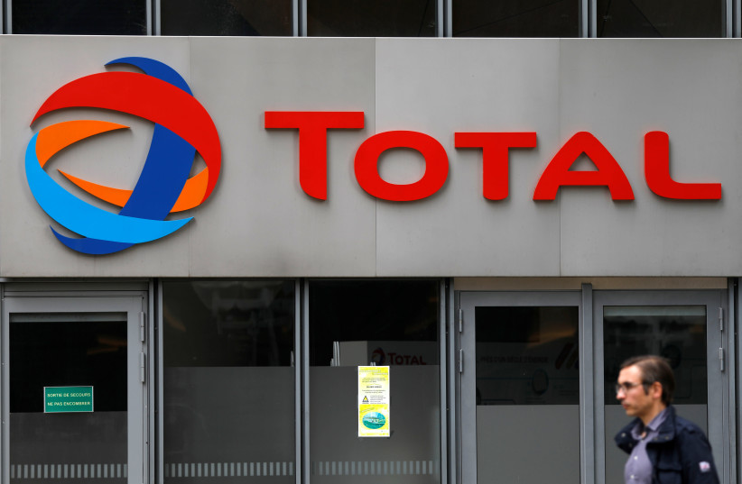 The logo of French oil giant Total is seen at La Defense business and financial district in Courbevoie, near Paris, France. May 16, 2018 (photo credit: REUTERS)