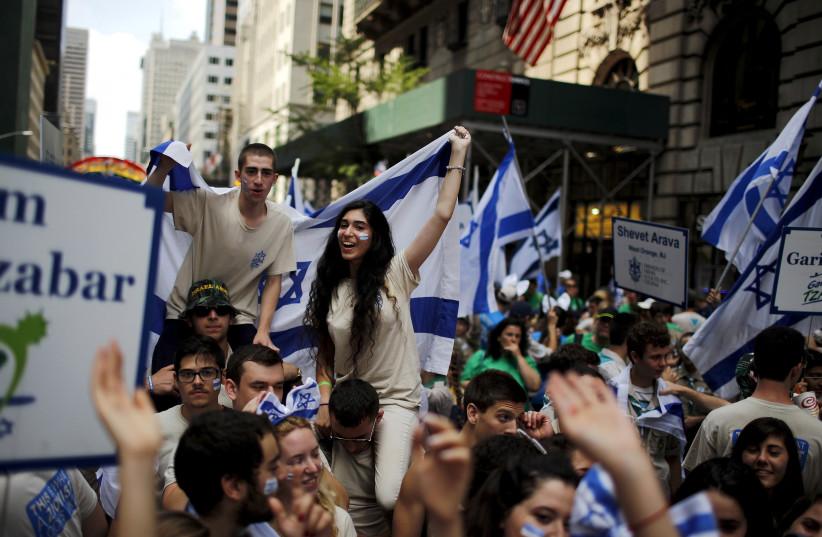 People take part in the 51st annual Israel parade in Manhattan, New York May 31, 2015. (photo credit: REUTERS/EDUARDO MUNOZ)