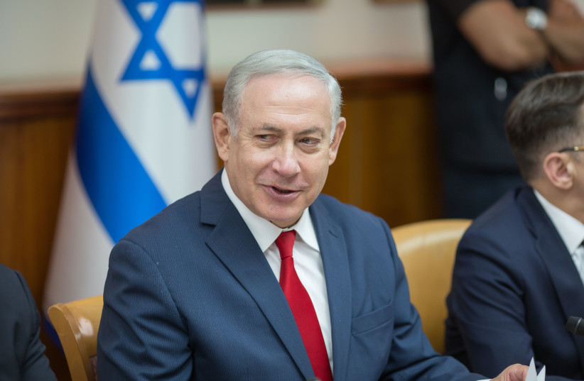 Prime Minister Benjamin Netanyahu at a weekly cabinet meeting, May 27, 2018. (photo credit: EMIL SALMAN/POOL)