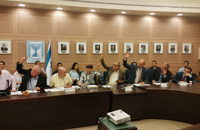 MKs voting in favor of the Pay for Slay bill Wednesday at the Knesset Foreign Affairs and Defense Committee June 27, 2018 (credit: COURTESY AVI DICHTER'S OFFICE)