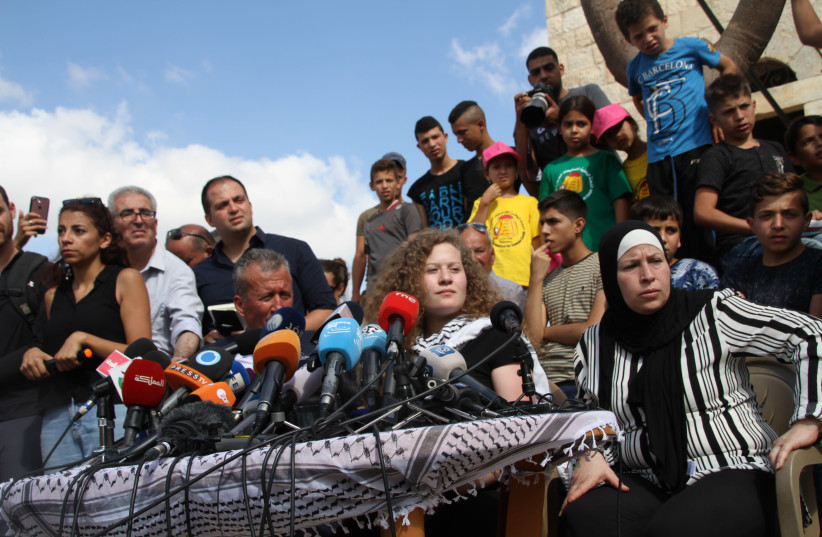 Ahed Tamimi next to her mother (R) Bassam and father Bassam (L)  (credit: TOVAH LAZAROFF)