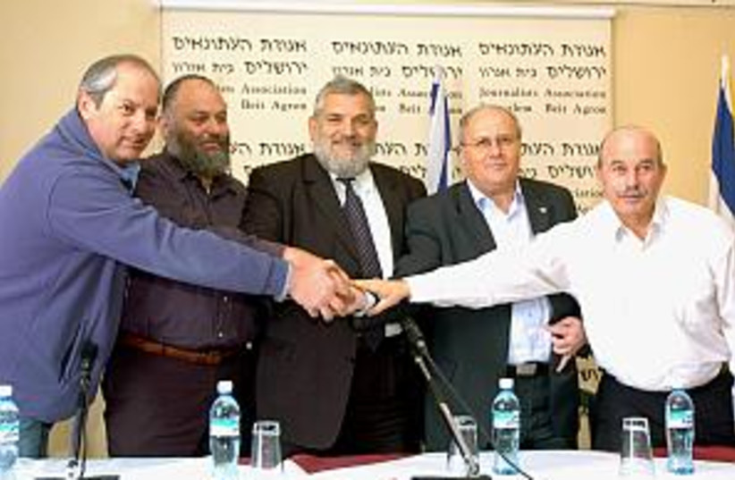 NRP, NU mks shake hands (photo credit: Ariel Jerozolimski)