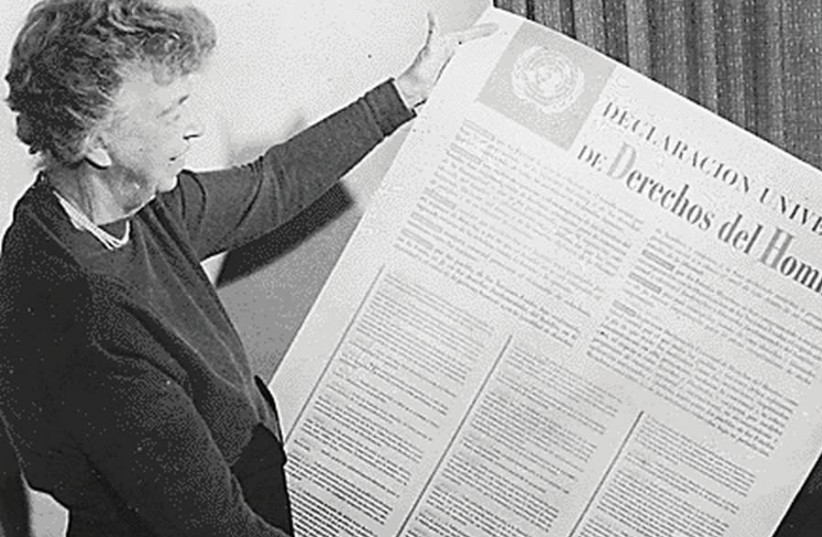 Then-US delegate to the United Nations General Assembly Eleanor Roosevelt holds the UN Universal Declaration of Human Rights in Spanish, in 1948 (credit: Wikimedia Commons)