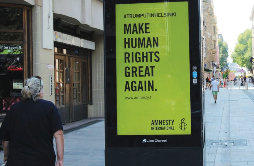 Amnesty international billboard (photo credit: REUTERS)