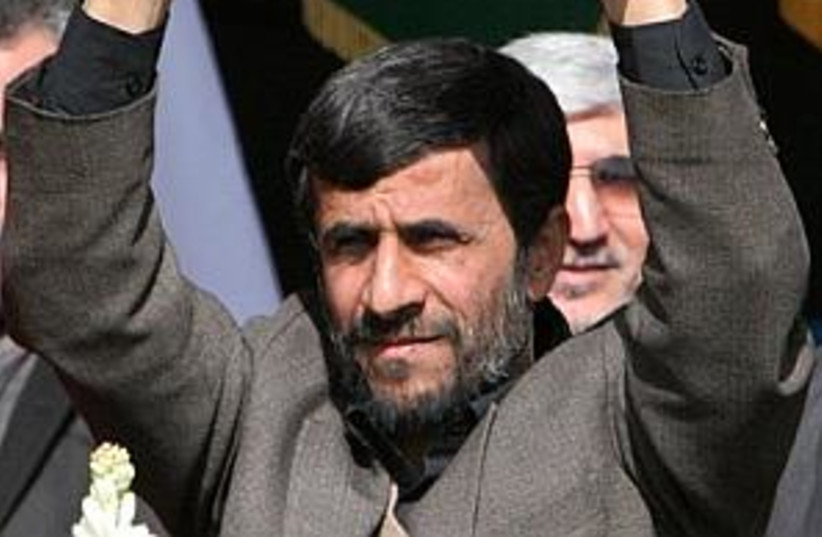 ahmadinejad, hands in ai (photo credit: AP [file])