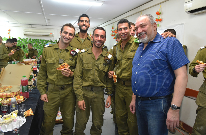 Defense Minister Avigdor Liberman with soldiers from the 7th Armored Brigade  (credit: ARIEL HERMONI / DEFENSE MINISTRY)