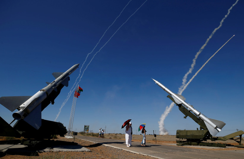 People watch S-300 air defense missile systems launching missiles during the Keys to the Sky competition at the International Army Games 2017 at the Ashuluk shooting range outside Astrakhan, Russia, August 5, 2017.  (credit: REUTERS/MAXIM SHEMETOV)