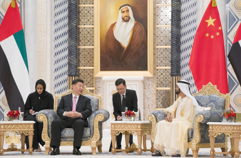 PRIME MINISTER and Vice President of the United Arab Emirates and Ruler of Dubai Sheikh Mohammed bin Rashed al-Maktoum meets with Chinese President Xi Jinping at the Presidential Palace in Abu Dhabi, United Arab Emirates in July (photo credit: REUTERS)