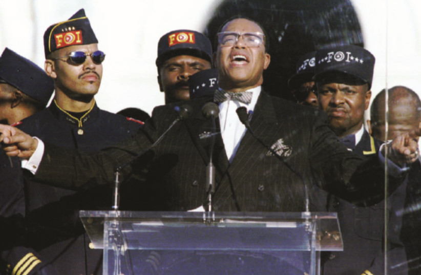 NATION OF ISLAM leader Louis Farrakhan addresses of marchers at the Mall in Washington, DC, during the ‘Million Man March’ in 1995 (credit: MIKE THEILER/REUTERS)