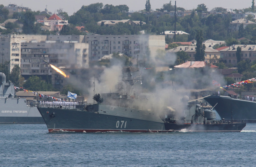 The Russian small anti-submarine ship Suzdalets fires a missile during a rehearsal for the Navy Day parade in the Black Sea port of Sevastopol, Crimea, July 27, 2017 (credit: PAVEL REBROV/REUTERS)