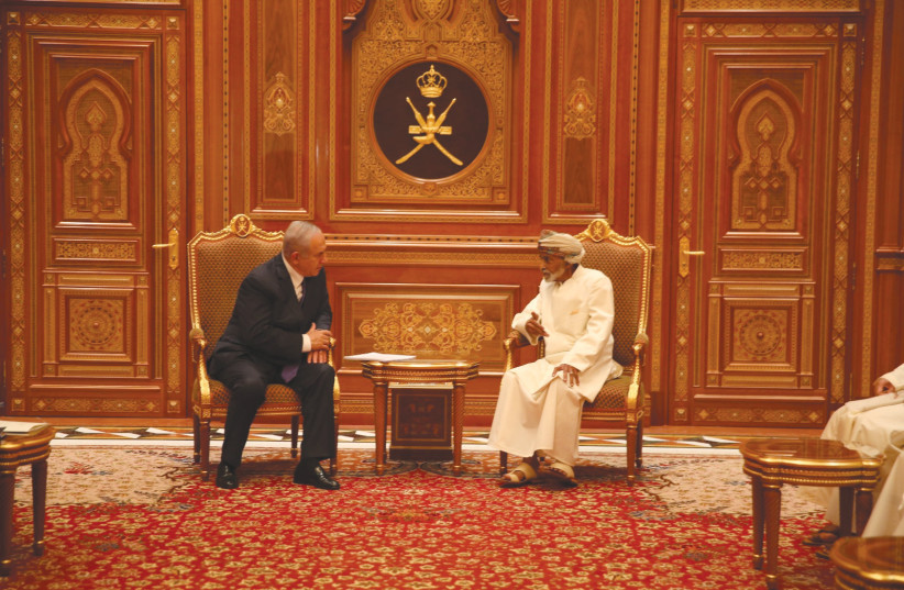 PRIME MINISTER Benjamin Netanyahu meets Sultan Qaboos bin Said in Oman. (photo credit: GPO/REUTERS)