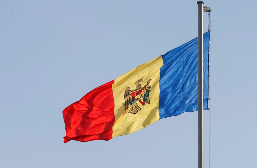 Moldova's national flag is seen in central Chisinau, Moldova (credit: GLEB GARANICH / REUTERS)