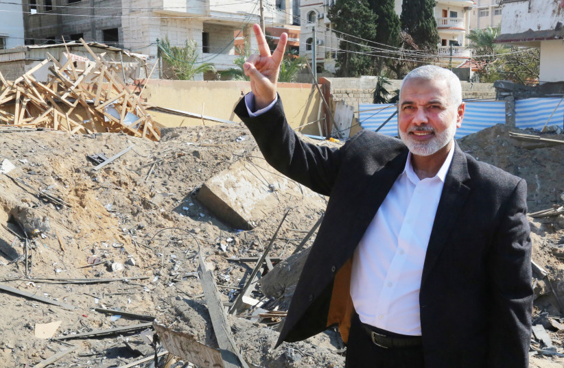 Hamas chief Ismail Haniyeh next to his destroyed office (REUTERS/Handout) (photo credit: HANDOUT/REUTERS)