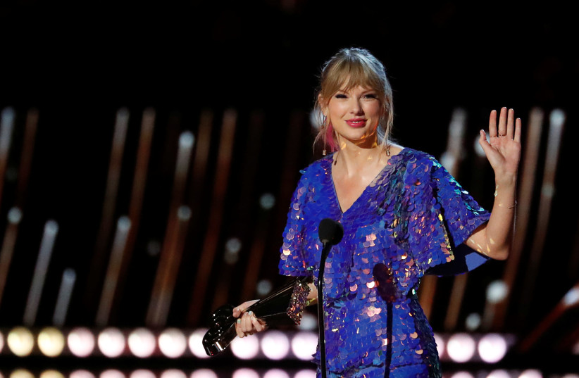 Singer Taylor Swift receives the Tour of the Year award during the iHeartRadio Music Awards in Los Angeles, California, U.S., March 14, 2019.  (credit: REUTERS/MARIO ANZUONI)