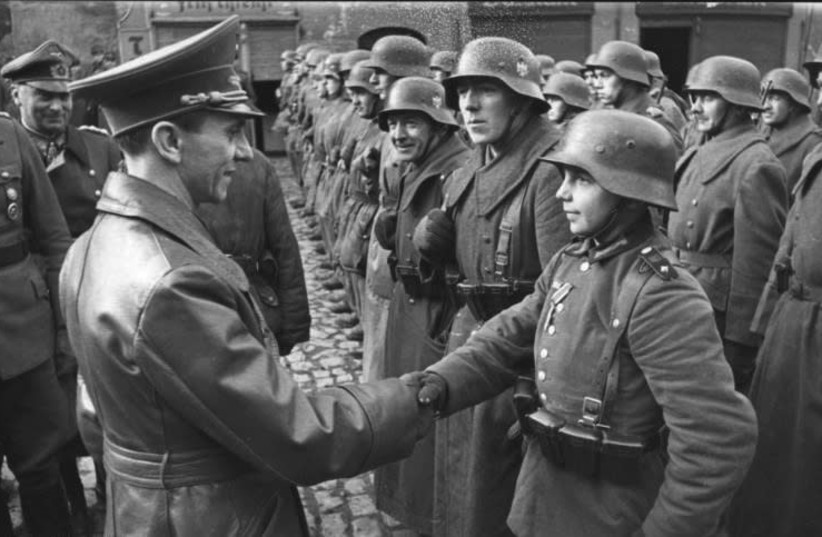 9 March 1945: Goebbels awards a 16-year-old Hitler Youth, Willi Hübner, the Iron Cross for the defence of Lauban (credit: Wikimedia Commons)