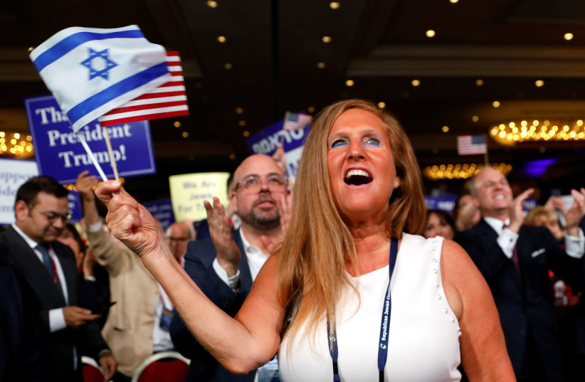 A supporter cheers as U.S. President Donald Trump addresses the Republican Jewish Coalition 2019 Annual Leadership Meeting in Las Vegas, Nevada, U.S., April 6, 2019 (photo credit: KEVIN LAMARQUE/REUTERS)