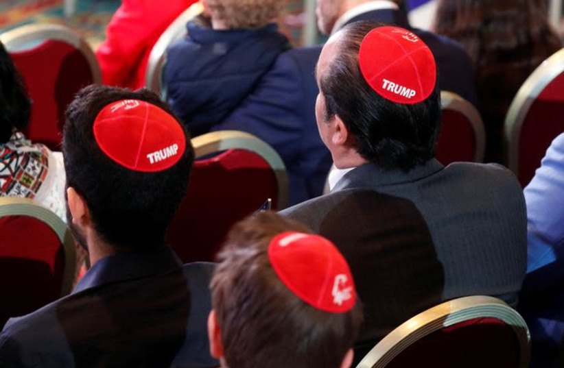 Men wear Trump yarmulkes while waiting for U.S. President Donald Trump to address the Republican Jewish Coalition 2019 Annual Leadership Meeting in Las Vegas (credit: REUTERS/KEVIN LAMARQUE)