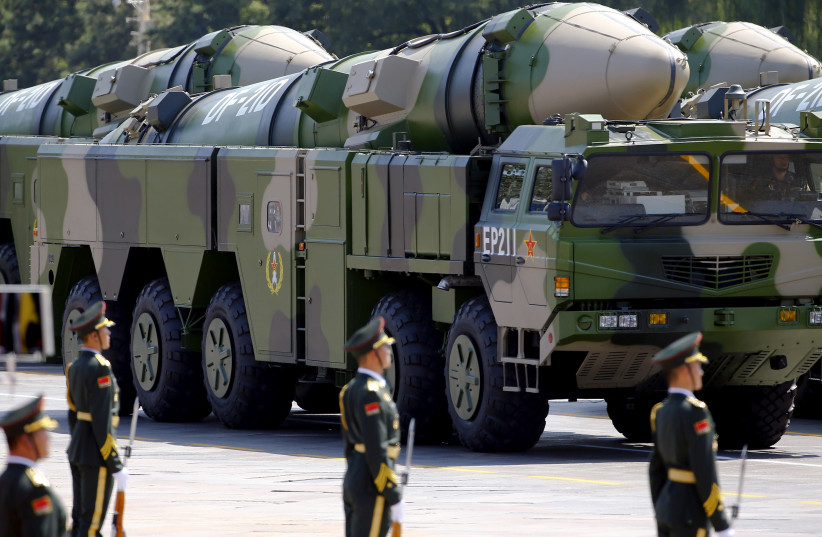 FILE PHOTO - Military vehicles carrying DF-21D ballistic missiles roll to Tiananmen Square during a military parade to mark the 70th anniversary of the end of World War Two, in Beijing, China, September 3, 2015 (credit: DAMIR SAGOLJ/ REUTERS)