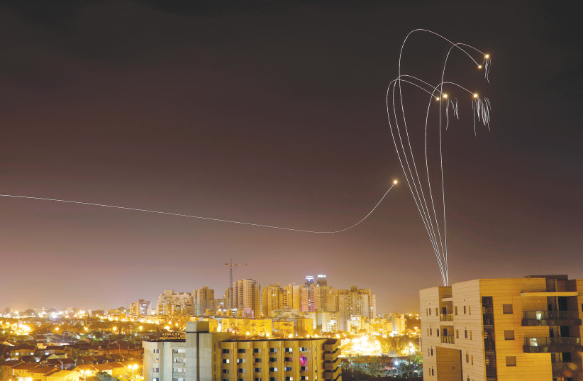 THE IRON DOME air defense system fires interceptor missiles over Ashkelon on Sunday. (credit: AMIR COHEN/REUTERS)