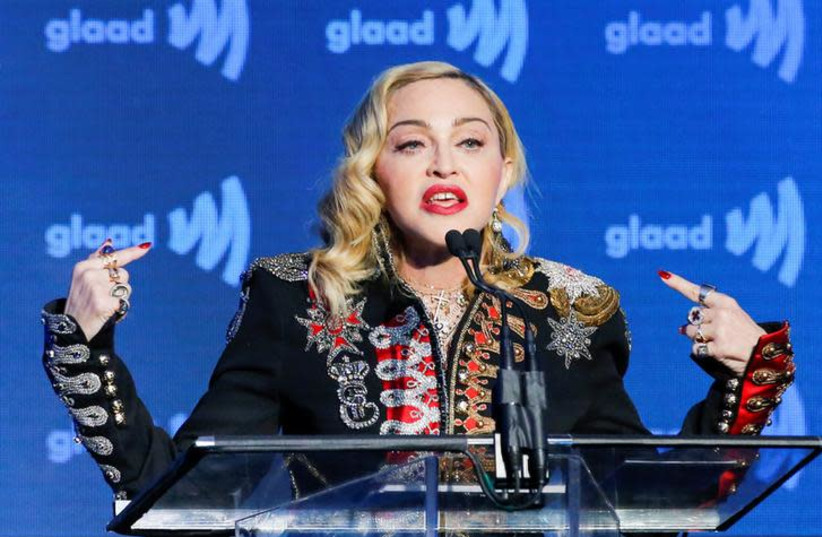 Singer Madonna speaks to guests after receiving the Advocate for Change award during the 30th annual GLAAD awards ceremony in New York City (photo credit: REUTERS/EDUARDO MUNOZ)