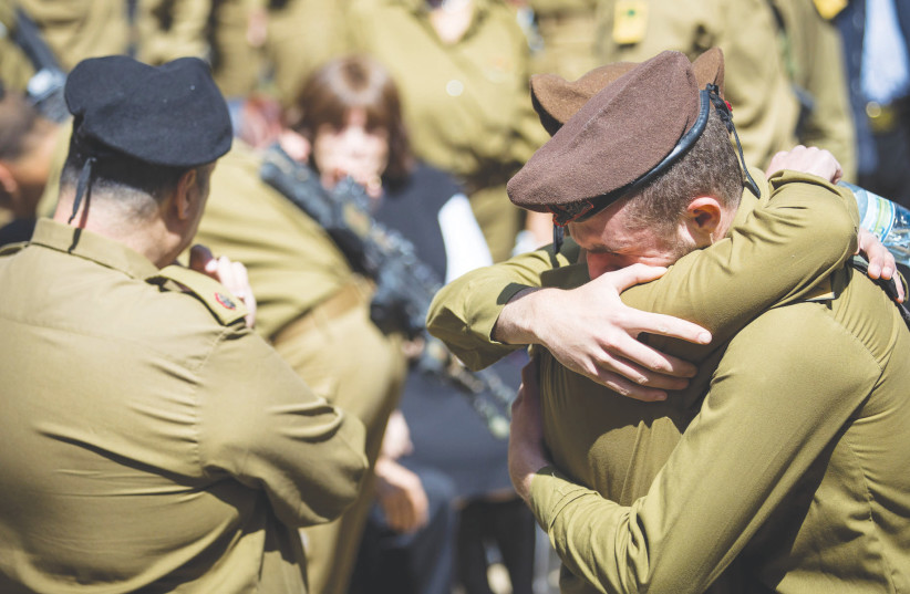 FRIENDS AND FAMILY mourn at the funeral of American lone soldier Alex Sasaki at the Mount Herzl Military Cemetery in Jerusalem, in March.  (credit: YONATAN SINDEL/FLASH 90)
