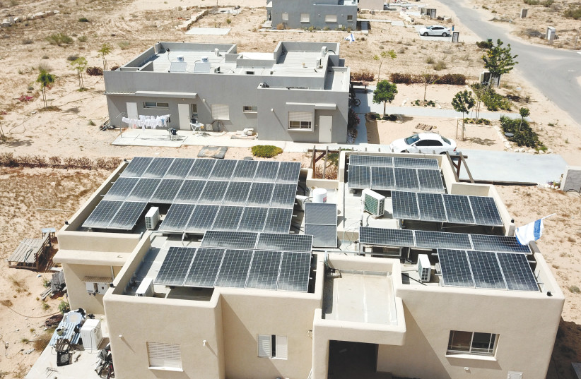  SOLAR PANELS on the roof of a house (credit: MORAG BITON)