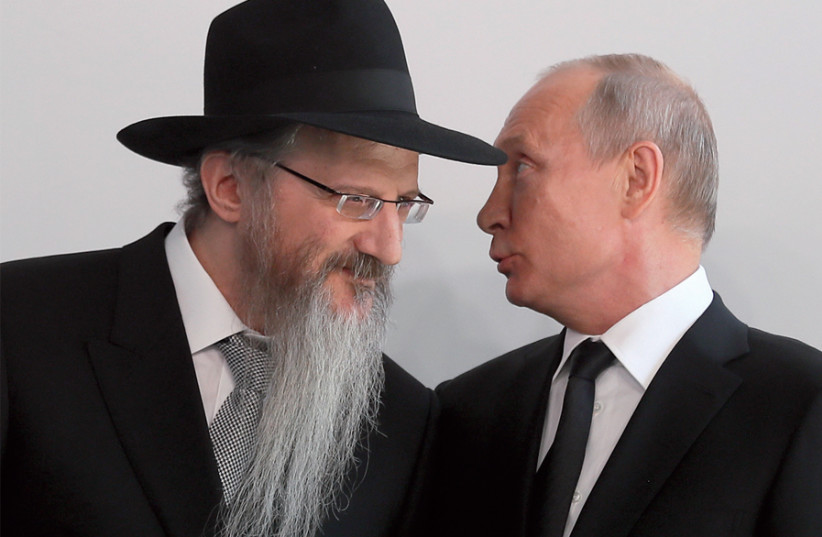 Russia’s President Vladimir Putin chats with Chief Rabbi Berel Lazar during a ceremony unveiling a monument to heroes of resistance in concentration camps and ghettos during World War II, on June 4 (photo credit: SERGEI ILNITSKY / REUTERS)