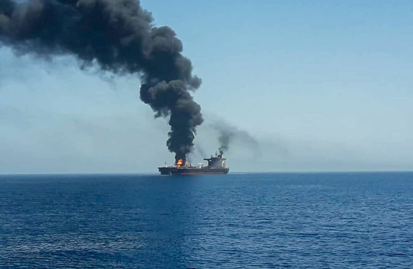 An oil tanker is seen after it was attacked at the Gulf of Oman (photo credit: ISNA/REUTERS)