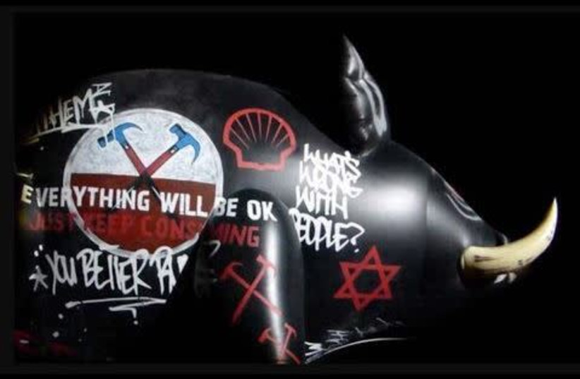 An inflatable pig with a Star of David painted on it was displayed during a Roger Waters performance of The Wall in Belgium in 2013 (credit: Courtesy)