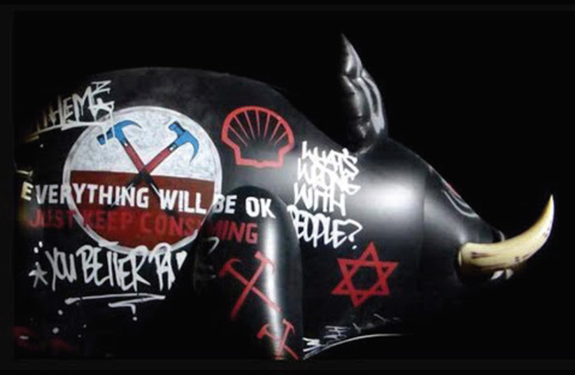 An inflatable pig with a Star of David painted on it was displayed during a Roger Waters performance of The Wall in Belgium in 2013 (credit: Courtesy)