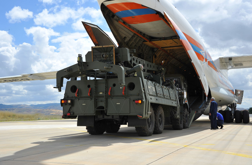 First parts of a Russian S-400 missile defense system are unloaded from a Russian plane at Murted Airport, known as Akinci Air Base, near Ankara, Turkey, July 12, 2019. (credit: REUTERS)