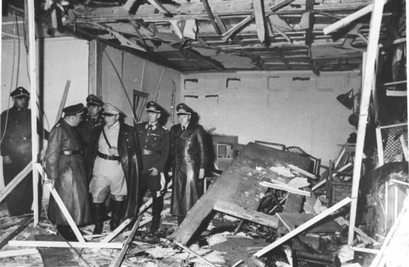 Herman Goring and Martin Bormann visit the destroyed barracks in the Führer's headquarters ''Wolf's Lair'' near Rastenburg, East Prussia, July 1944 (credit: GERMAN FEDERAL ARCHIVE/WIKIMEDIA COMMONS)