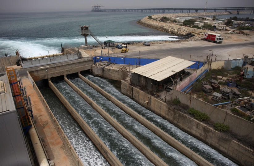 Brine water flows into the Mediterranean Sea after passing through a desalination plant in the coastal city of Hadera (credit: NIR ELIAS / REUTERS)