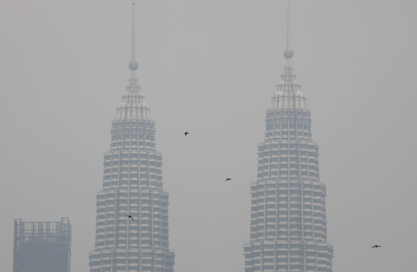 Petronas Twin Towers are shrouded by haze in Kuala Lumpur, Malaysia (credit: REUTERS/LIM HUEY TENG)