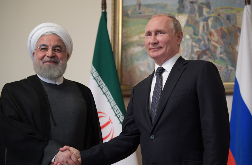 Russian President Vladimir Putin shakes hands with Iranian President Hassan Rouhani during a meeting on the sidelines of a session of the Supreme Eurasian Economic Council In Yerevan, Armenia October 1, 2019 (credit: REUTERS)