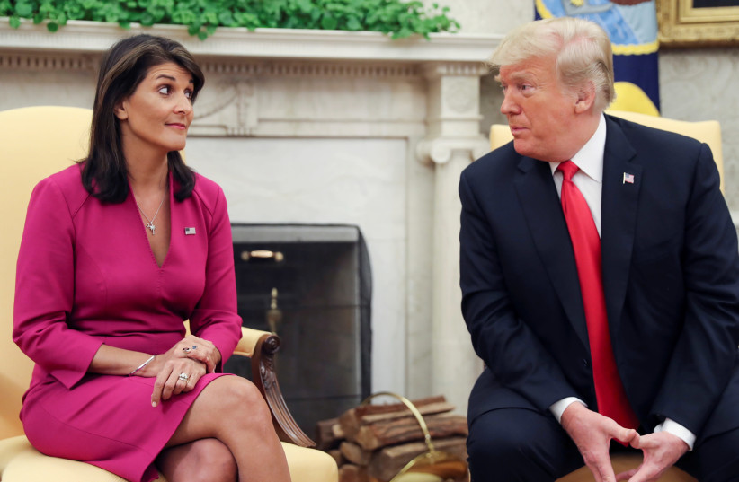 U.S. President Donald Trump talks with U.N. Ambassador Nikki Haley in the Oval Office of the White House after it was announced the president had accepted the Haley's resignation in Washington, U.S., October 9, 2018 (credit: REUTERS/JONATHAN ERNST)