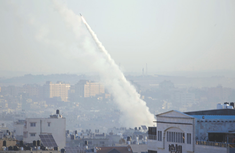 A ROCKET fired from Gaza by the Palestinian Islamic Jihad heads toward Israel this week (photo credit: MOHAMMED SALEM/REUTERS)