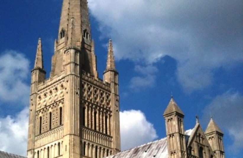 An image of the spire and south transept of Norwich Cathedral.