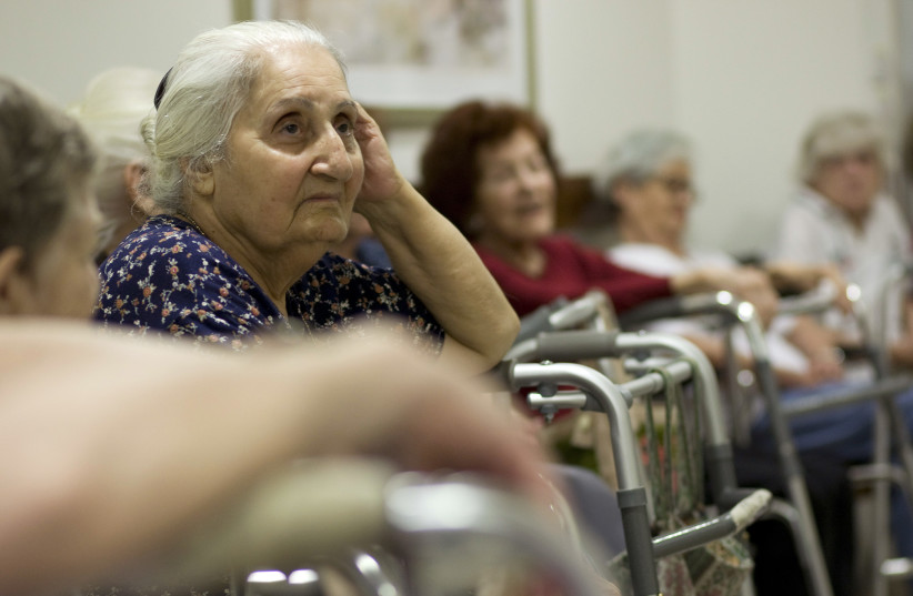 Elderly Israelis sit in a designated protected space in a senior citizens home in Jerusalem, June 2, 2009, as a siren is sounded during a nationwide civil defense drill simulating a rocket attack.  (credit: REUTERS)