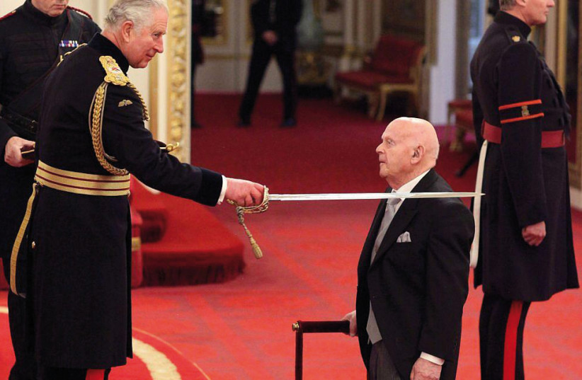 Ben Helfgott is knighted by Prince Charles at Buckingham Palace (credit: Courtesy)