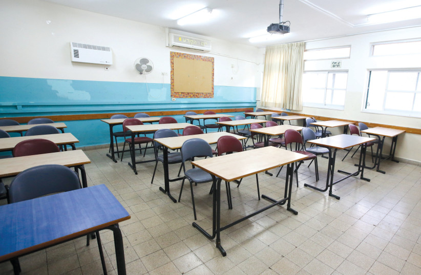 An empty classroom (credit: MARC ISRAEL SELLEM/THE JERUSALEM POST)
